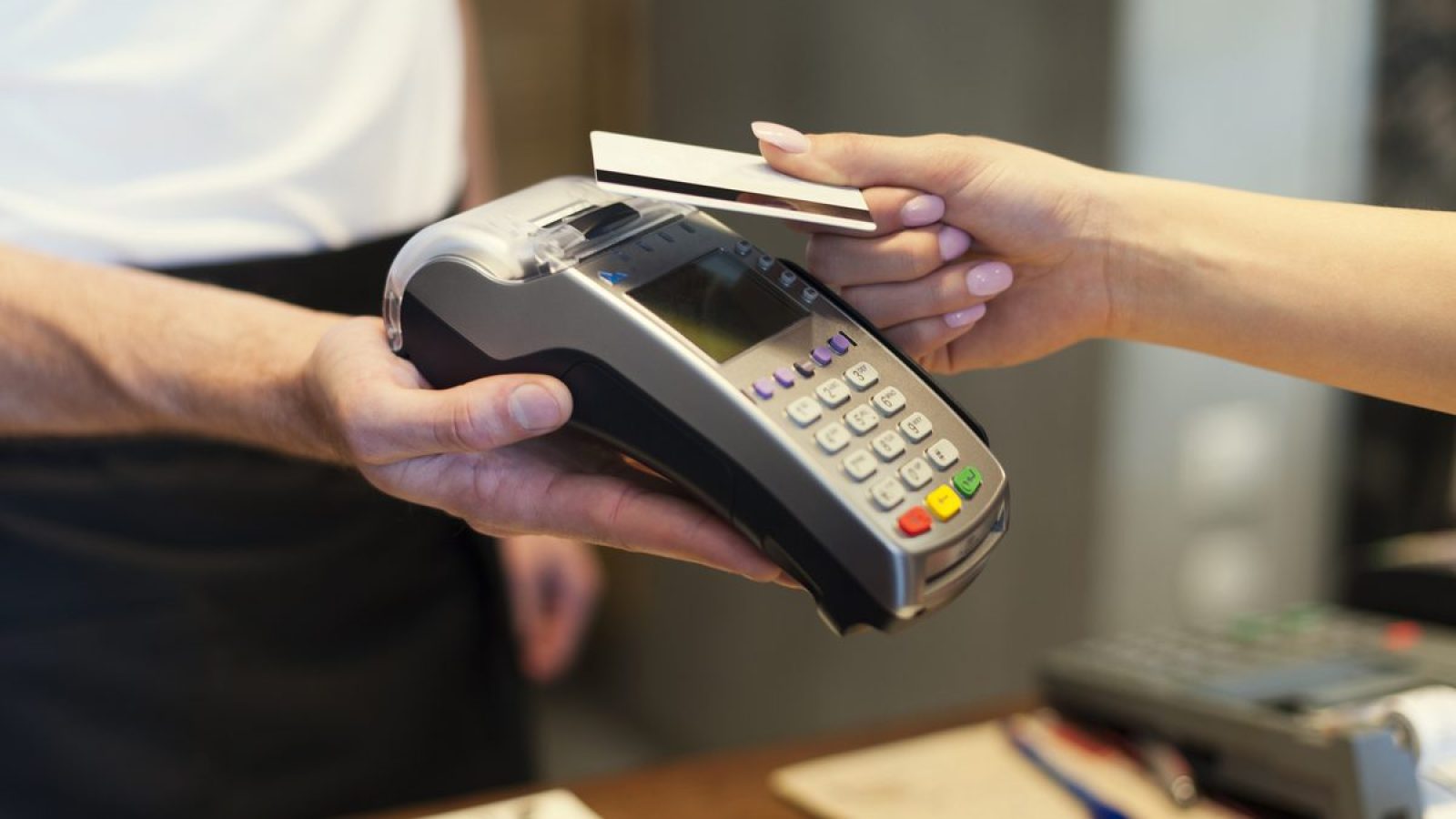 Close up of customer paying by credit card c9-blockchain